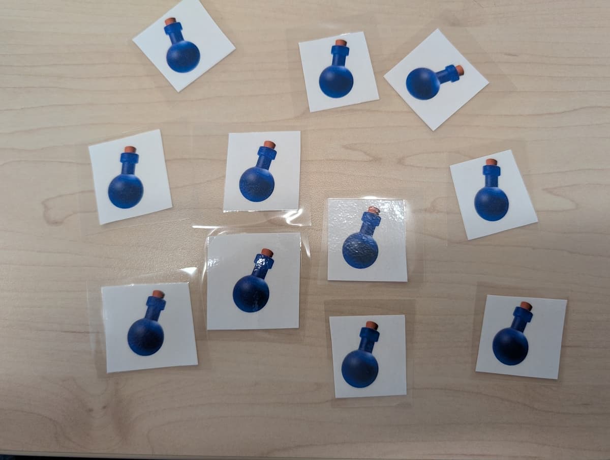 Laminerede eliksirkort brugt som fysiske belønninger